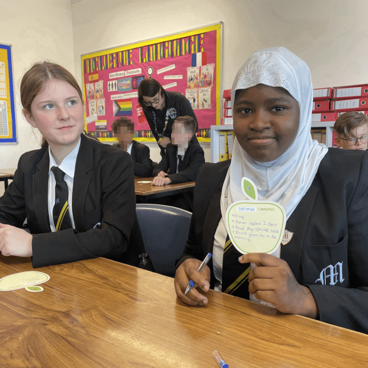 Photo of Fatima, Year 8, holding her mindapple card