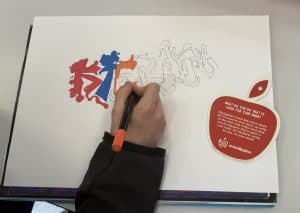 Mindapples graffiti-style lettering in progress on white paper, promoting mental health awareness and self-care activities.