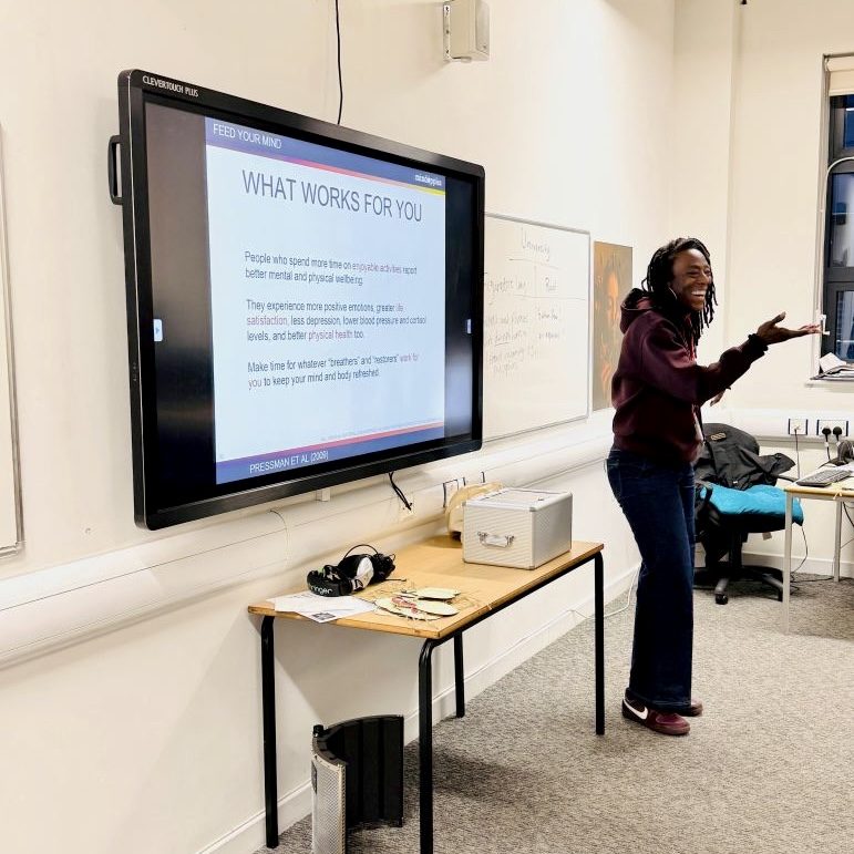 An inspirational mental health workshop in a classroom setting.